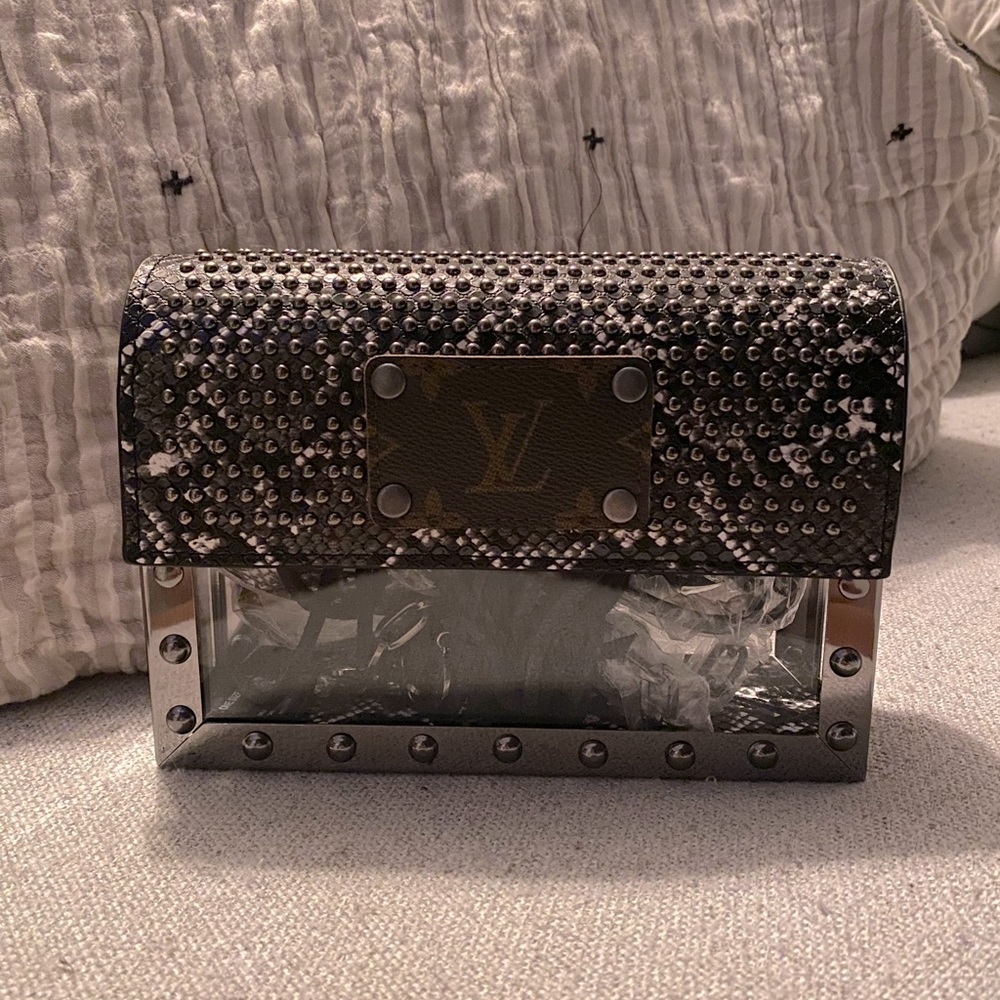 Repurposed L*V*clear purse. Never used. Comes with certificate & matching strap.